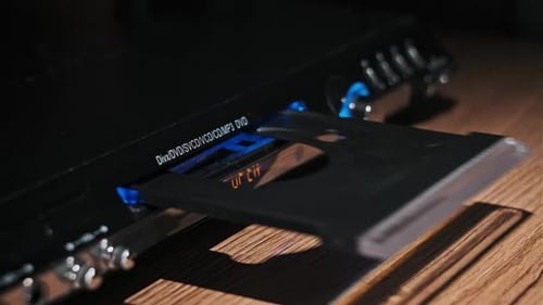 DVD Compact Disc is Inserted Into The Player