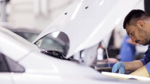 Car Service, Repair, Maintenance and People Concept - Mechanic Man with Wrench