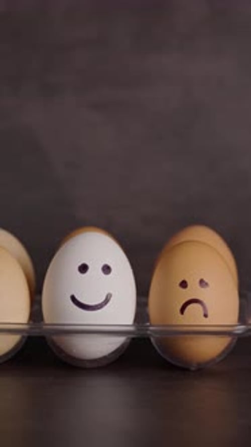 Eggs with Drawn Faces in a Plastic Tray