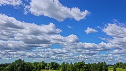 Clouds Time Lapse Over Trees On Bright Day