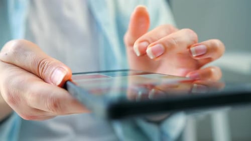 Woman Scrolling Through Social Media Feeds on Smartphone Close Up