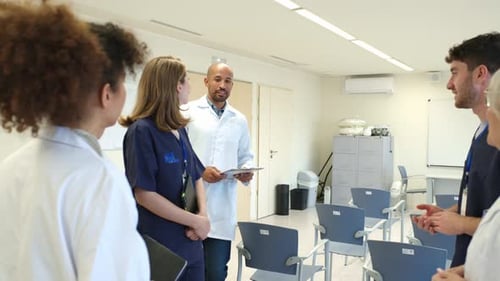 Medical Team Discussing Patient Cases in Hospital Meeting Room