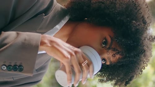 Woman Drinking Coffee Takeaway in City Park Close Up African Lady Vertically