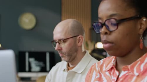 Multiethnic Software Developers Coding on Computers in Open Space Office