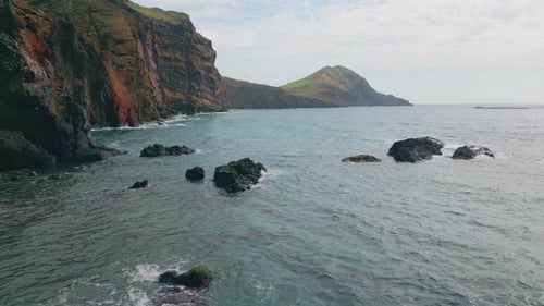 Ocean Water Rippling Rocks on Outdoor Panorama Beautiful Green Cliff at Sea