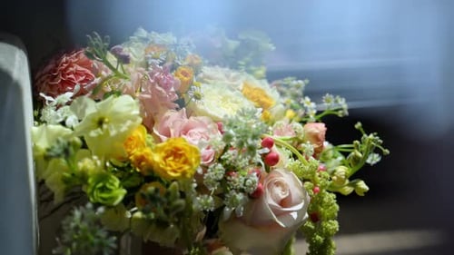 Close Up View of Wedding Multicolored Bouquet of the Flowers on Table at the Wedding Day Move Camera
