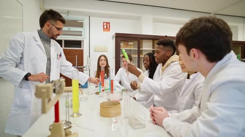 Diverse Students Conduct Science Experiment with Teacher