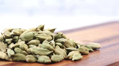 Close Up of Cardamom on a Chopping Board on Table