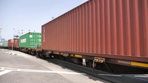 Cargo Containers Transported via Railway on Sunny Day