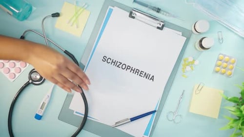 Medical Supplies with Schizophrenia Diagnosis on Clipboard
