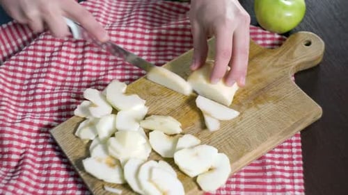 Cutting Apple on Slices. Preparing Ingredients for Baking Apple Pie. Chef Slicing