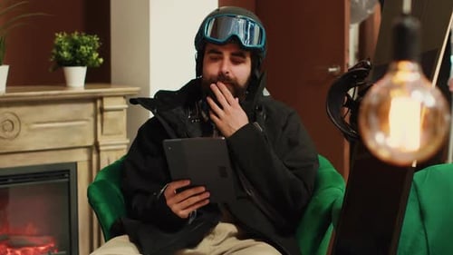 Male Hotel Guest Using Digital Tablet
