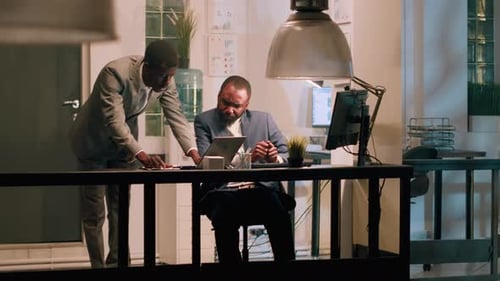 Employee Helps Coworker Solve Tasks