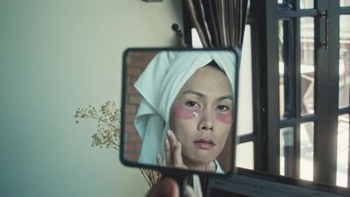 Young Asian Transgender Queer Man Doing Makeup