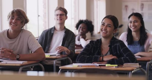 Education, learning and funny high school student group in a classroom sitting at a desk