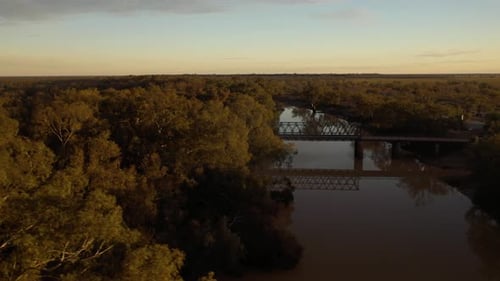 Aerial dolly over river in outback desert