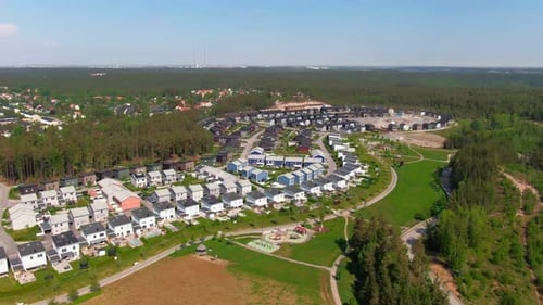 Aerial View of Suburban Neighborhood Surrounded by Forest