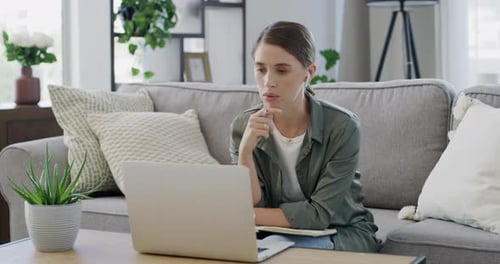 Woman in Green Having a Remote Meeting