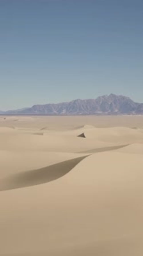 A Desert Landscape with Mountains in the Distance