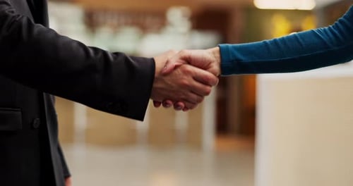 Hotel, reception and people with handshake for greeting, introduction or help for accommodation