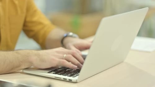 Close up of Hands Typing on Laptop