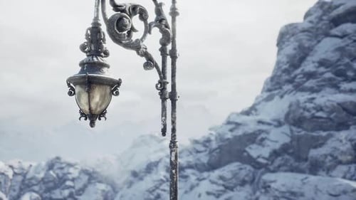 Snowy Mountain Landscape Featuring an Elegant Vintage Lamp Post Amidst Frost