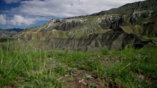 A Mountain Range with a Grassy Hillside