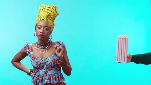 An Elegant Woman Adorned with a Beautifully Colorful Headwrap and Dressing in Vibrant Attire