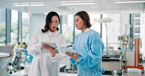 Japanese doctor, teamwork and tablet in science laboratory for innovation, breakthrough and advice