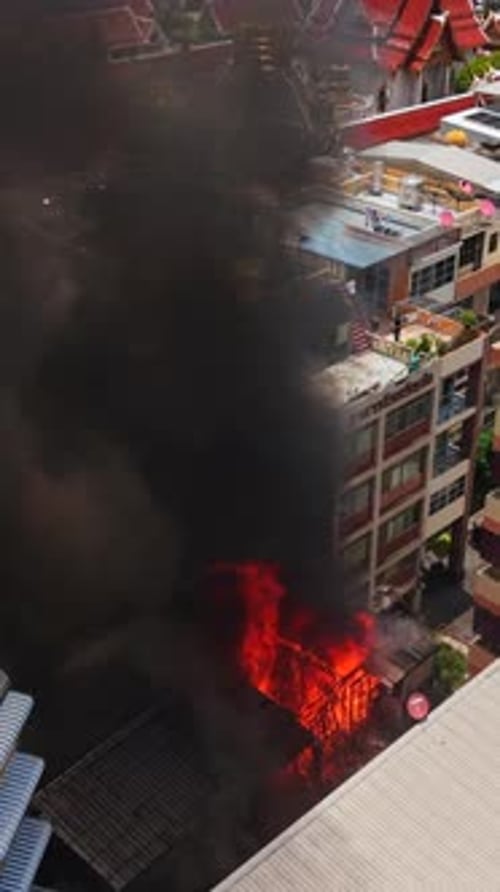 Black Smoke Rising From an Urban Building in the Bangkok Skyline in the Khaosan Neighborhood on May