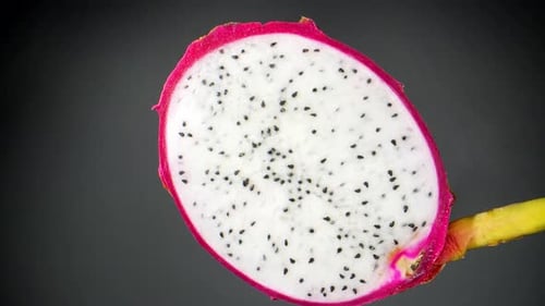 The vibrant colors and intricate details of a half dragon fruit
