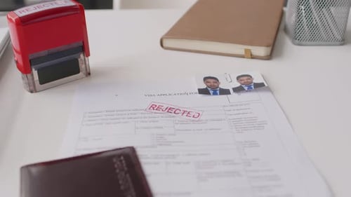 Rejected Visa Application Form Lying on Table in Consulate