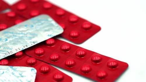 Close Up of Red Pills in Blister Packs
