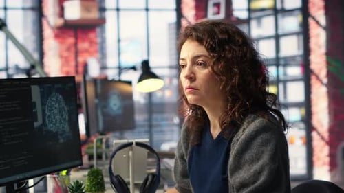 Female IT Engineer Doing Maintenance on Artificial Intelligence Systems