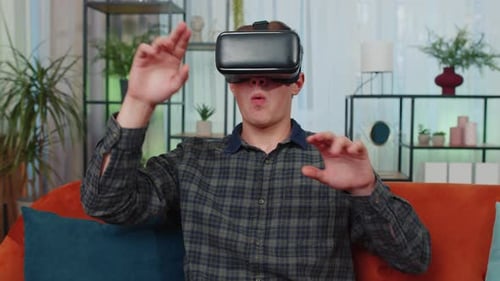 Young Man Using VR Headset at Home