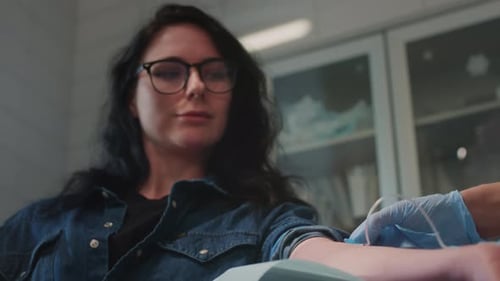 Adult Gets Blood Drawn in Clinical Setting