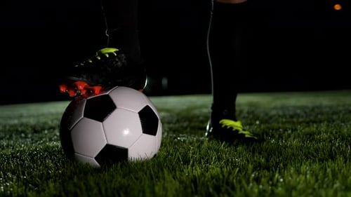 Soccer Player Athlete Training Foot Ball Sport on Soccer Field at Night