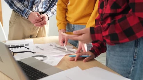 Team Analyzes Data Charts in Office