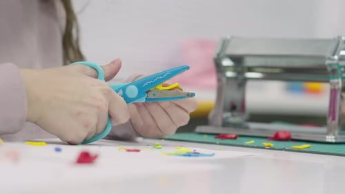Children Sculpt with Their Hands on Table Made of Polymer Clay