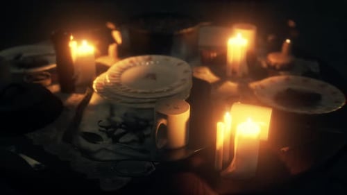 Flickering Candlelight Dinner Table Setting with Plates