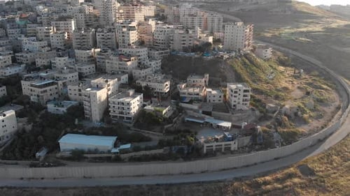 Israel Palestine divided by security fence in Jerusalem aerial view
