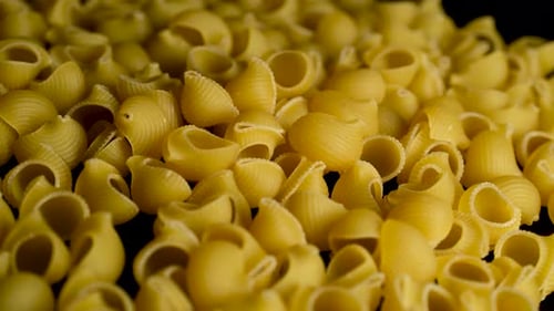Raw Pasta Spread on Rotating Tray – Close Up Food Shot