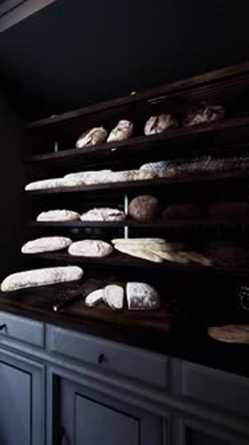 Assorted Breads Displayed on Old Bakery Shelf