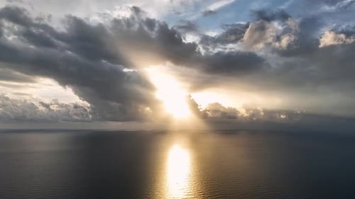 Beautiful Sunset Over Sea with Cloudy Orange Sky