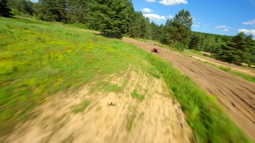 Dirtbike Rider on Winding Rural Dirt Track