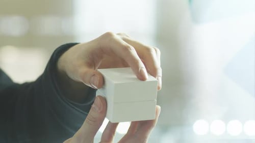 Close Up of Hand Opening Ring Box
