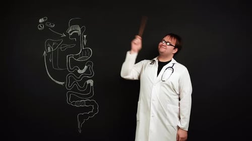 Doctor Gastrologist Shows in Chalk Drawing How Pills Can Help with Stomach or Intestinal Pain