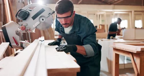 Wood, project and male carpenter in workshop, project and woodwork with saw equipment