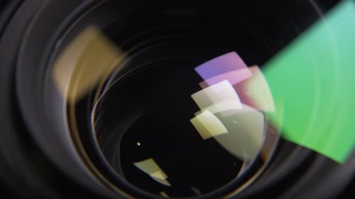 Aperture blades opening and closing slowly with a black background in a de-clicked lens. Macro shot.