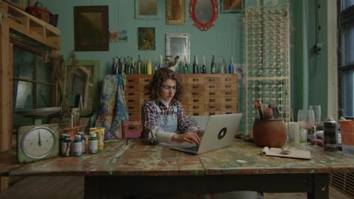 Woman Working Online In Creative Workshop Adult Artist Typing on Laptop Creative Person Using